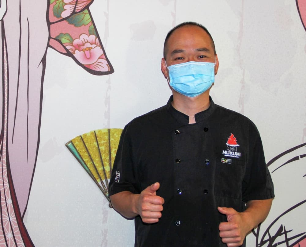 Yunchen “Tony” Cai owns Nukumi Japanese Steak House in Kingwood with his wife, Shuxia. (Wesley Gardner/Community Impact)