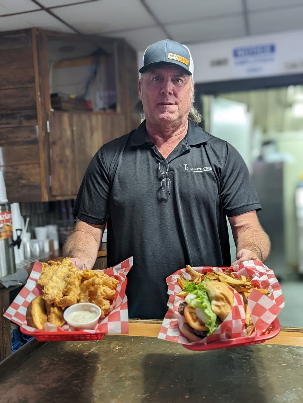 Co-owner Trea Luedke opened The Feed Store Grill and Bar with his wife Toni in December. (Jishnu Nair/Community Impact Newspaper)
