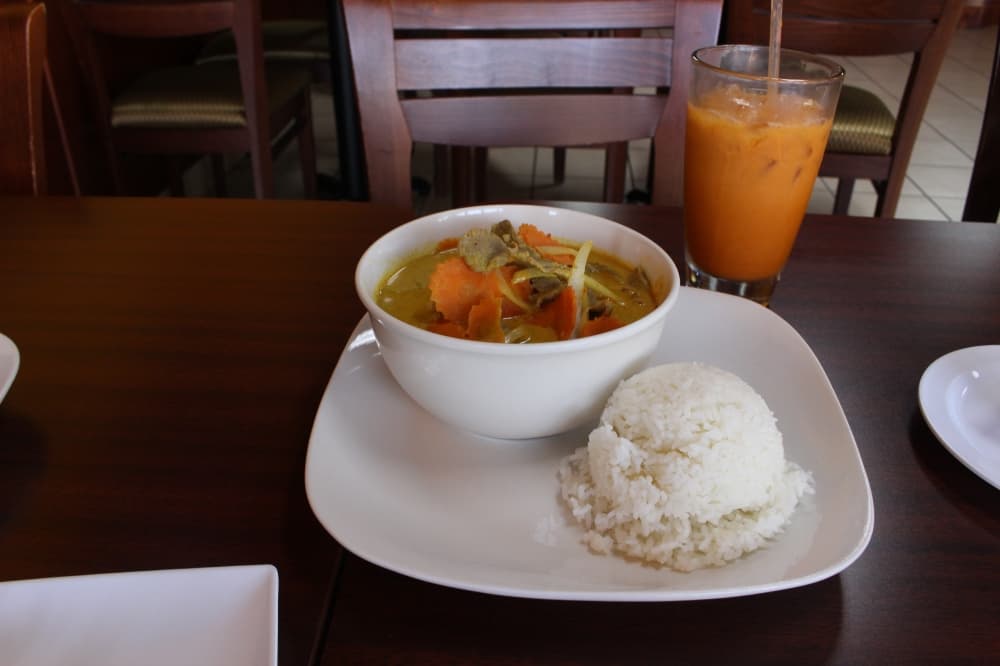 Yellow curry ($12) includes coconut milk, yellow curry paste, potato, carrot and onion and is served with jasmine rice. The price depends on the choice of protein. (Peyton MacKenzie/Community Impact)
