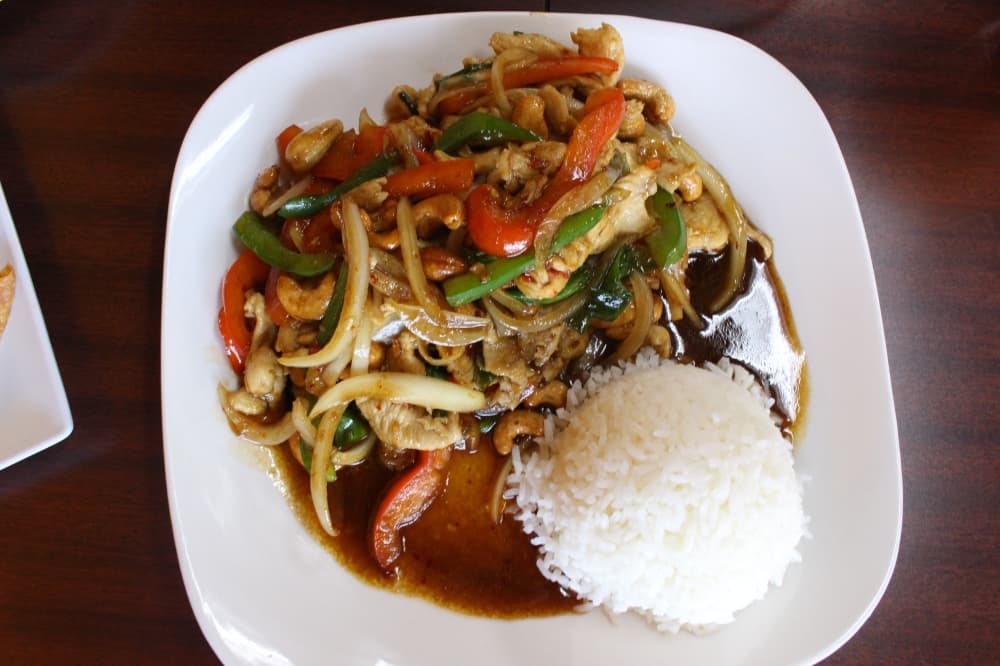 Cashew Nut ($12) is served with chicken, beef or shrimp and includes bell pepper, onion, cashews and chili paste with house sauce along with jasmine rice. (Peyton MacKenzie/Community Impact)