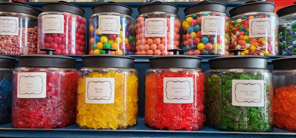 Customers can pick and choose which candies they want at self-serve candy jars. (Jarrett Whitener/Community Impact Newspaper)