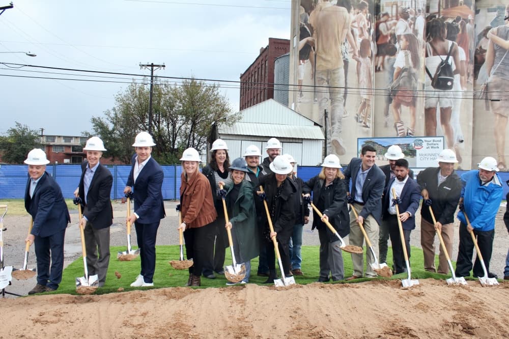 Members of the project's architectural and construction firms, along with city staff, broke ground on the site. (Shelbie Hamilton/Community Impact)