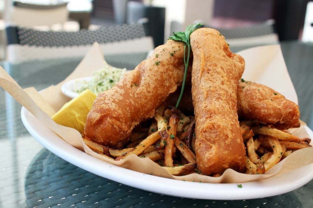 Fish and chips (market price) 
Beer-battered cod is served with hand-cut fries, crispy slaw and dill tartar sauce. (Karen Chaney/Community Impact)