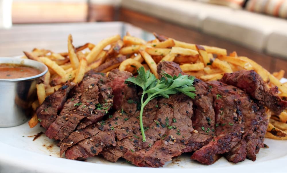 ‘London Broil’ steak frites ($37) 
A 10-ounce sliced Nebraska Angus flat-iron steak is served with fries. (Karen Chaney/Community Impact)