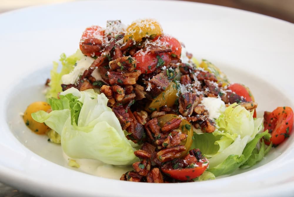Wedge my Way ($14) 
This salad features spiced pecans, pear tomatoes and bacon. (Karen Chaney/Community Impact)
