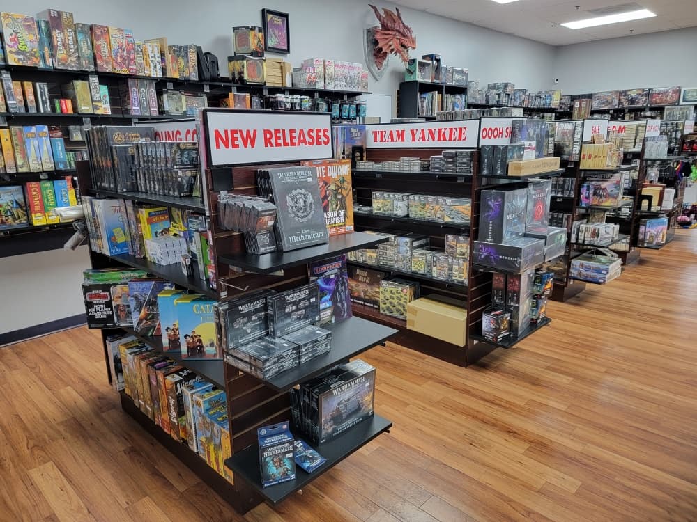 Various games are on sale in the retail space at the center of the store.