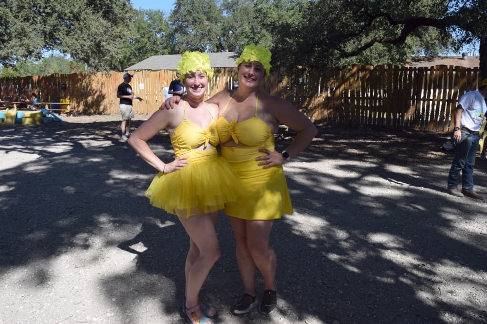From left: Leslie Paetschow and Heather Spearman dressed as synchronized swimmers at their anniversary party in preparation of being dunked in a dunk tank to raise money for a local nonprofit. (Darcy Sprague/Community Impact) 