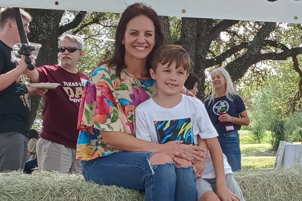 Ayla and son Thomas Rahmberg attend Hill Country Village Homeowners Association’s Villagefest on Oct. 23 at City Hall. (Edmond Ortiz/Community Impact)
