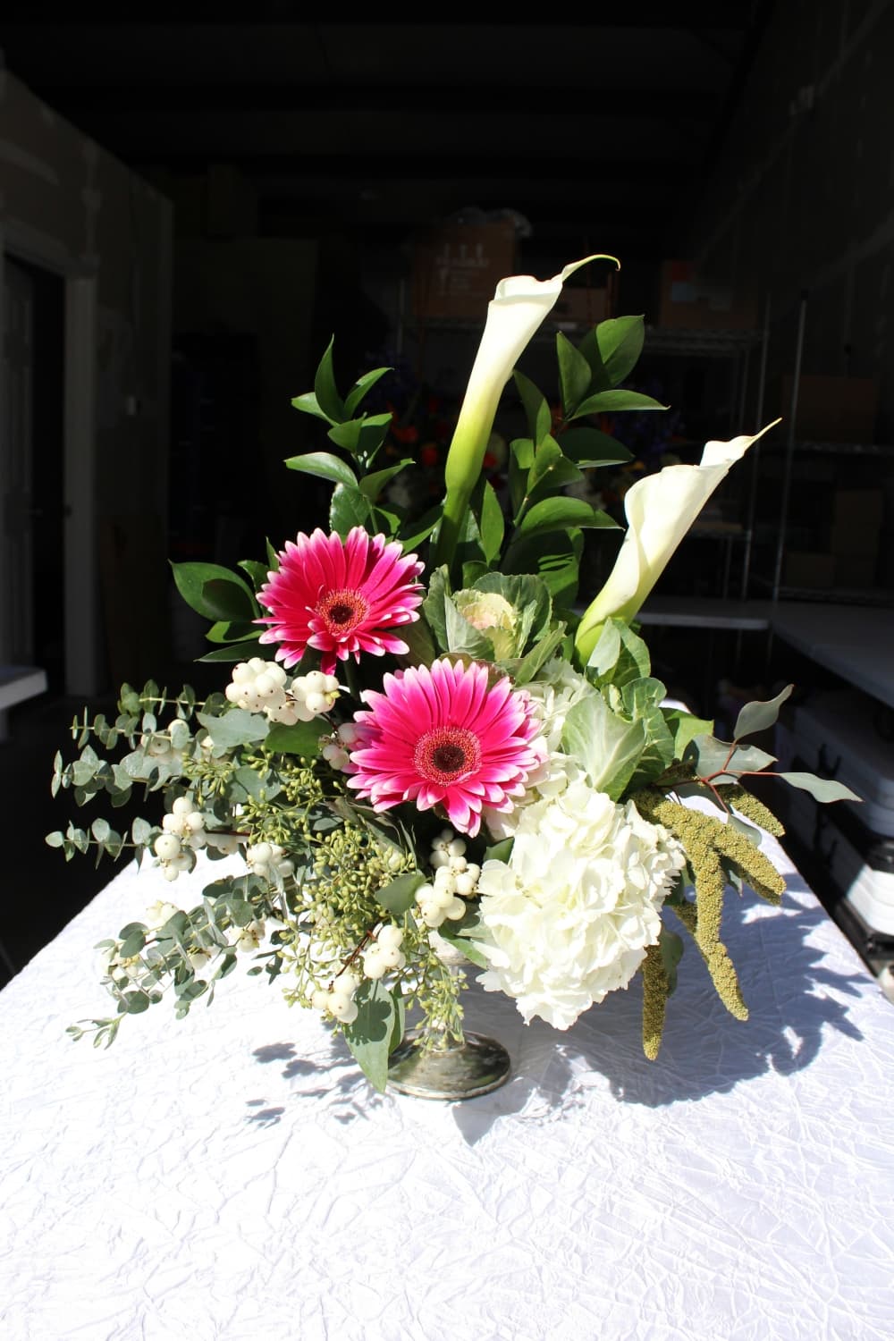 This arrangement features eucalyptus, snowberries, gerbera daisies, hydrangea and kale. (Karen Chaney/Community Impact)