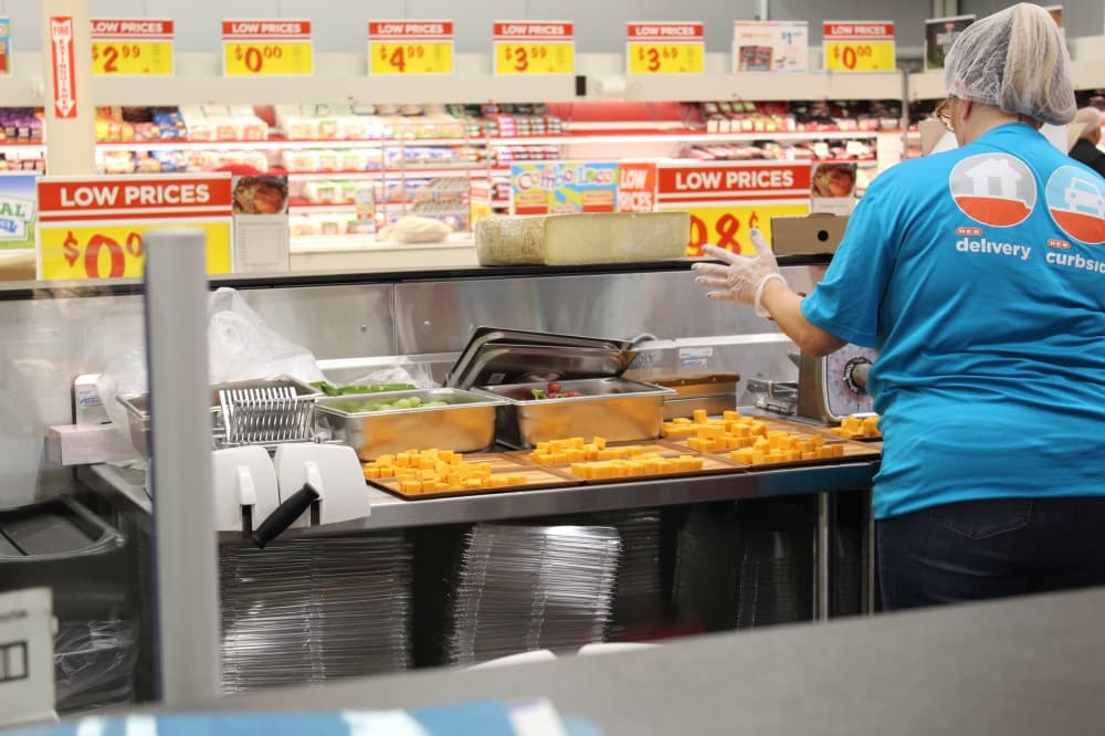 employee in cheese department