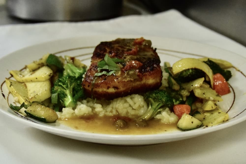 Chilean sea bass ($47.95) is oven roasted, and served with risotto and lemon butter sauce. (Amber Friend/Community Impact)