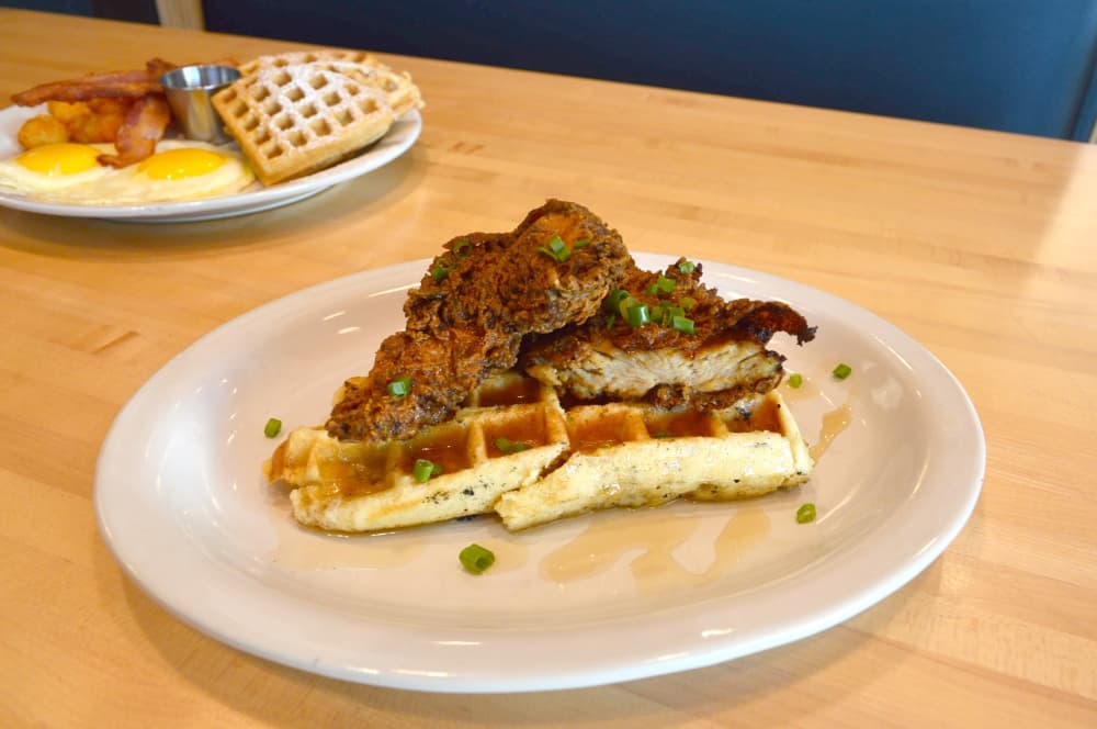The O.G.: a liege waffle topped with chicken and maple syrup or gravy ($12) (Hunter Terrell/Community Impact)