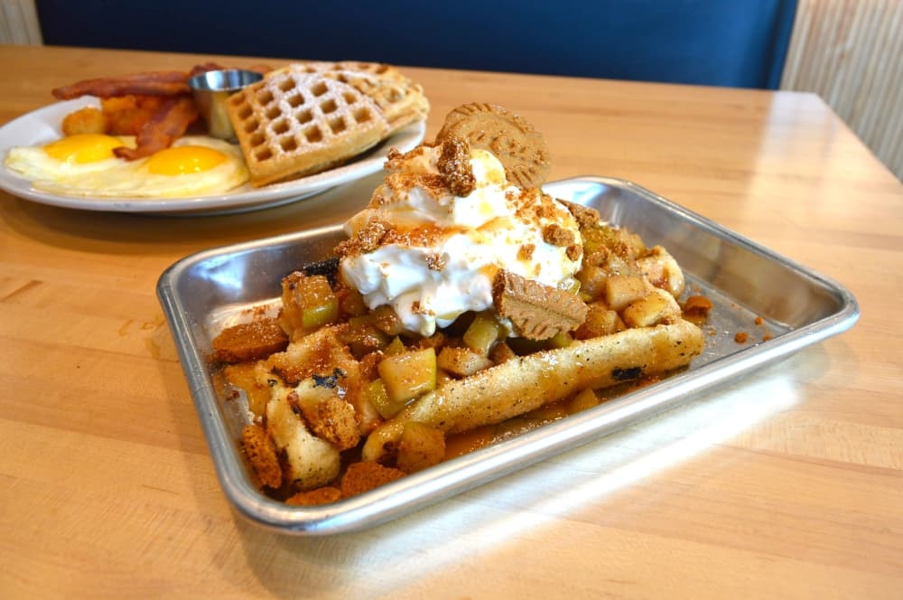 Apple of My Eye: a liege waffle topped with cinnamon apples, whipped cream, caramel and biscoff crumbs ($9) (Hunter Terrell/Community Impact)