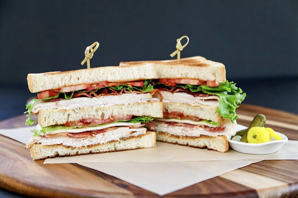 The R&D Club sandwich ($13.75) includes shaved Hill Farms turkey, beefsteak tomato, bacon and lemon-thyme aioli.  (Courtesy Radish and Dill Fine Food Market)