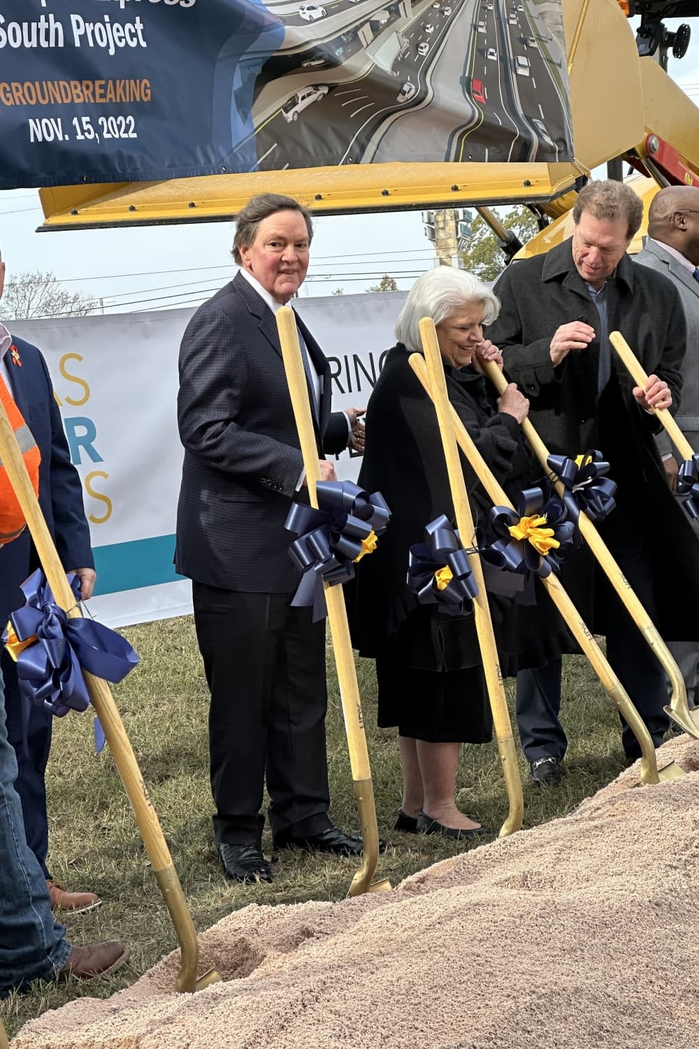 People standing with shovels