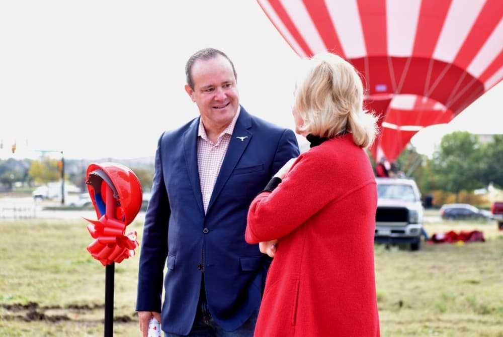 Man speaking to a woman