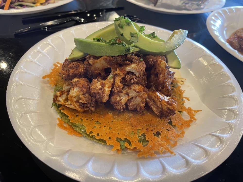 taco on a plate with avocado 