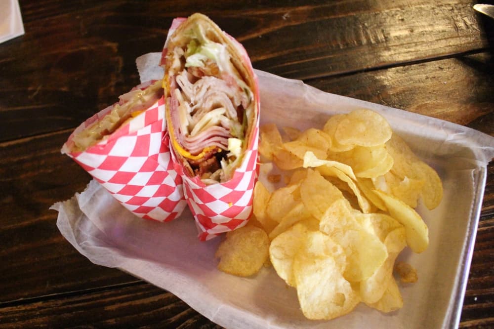 The Club Wrap ($10.95) is served with potato chips or a side salad or fries for an additional charge. (Peyton MacKenzie/Community Impact)