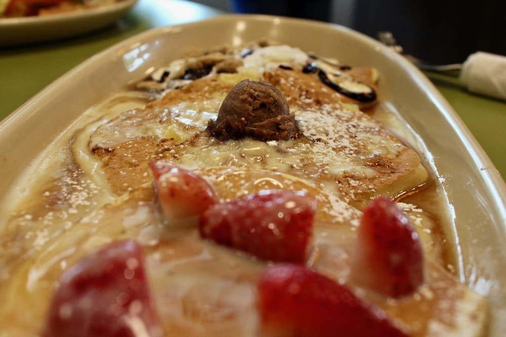The signature pancake flight includes three Snooze pancakes with staple or seasonal flavors. (Shelbie Hamilton/Community Impact)