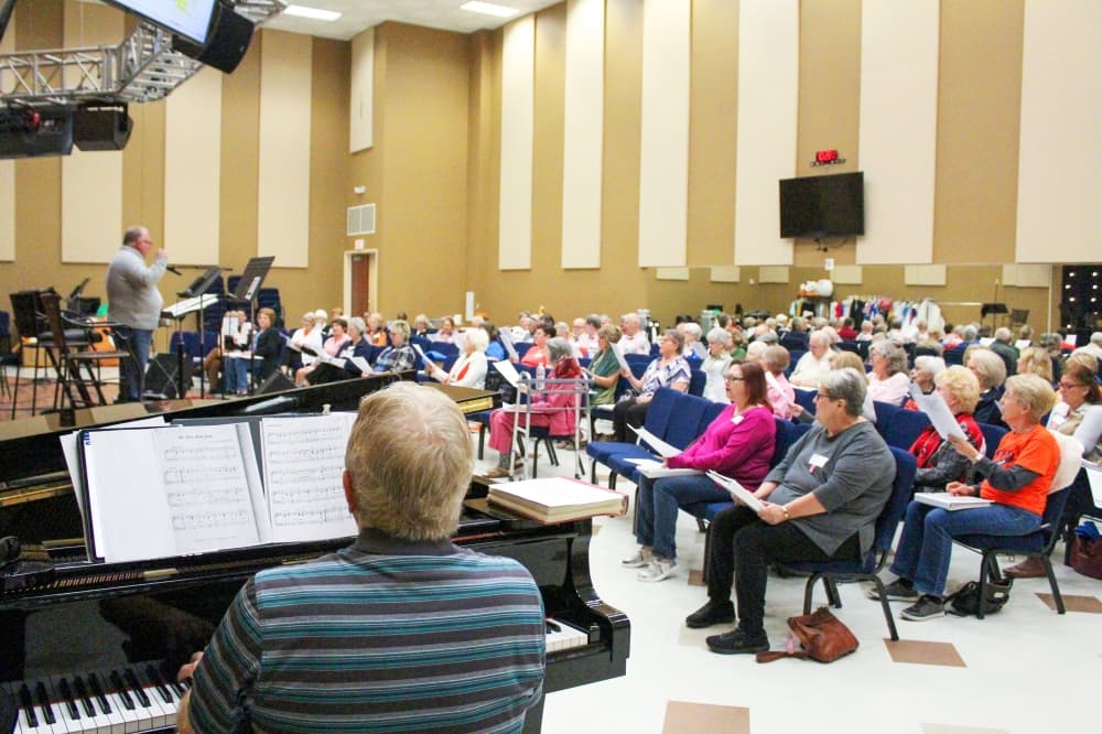The choir is directed by Michael Kay, and Charles Austin serves as one of its piano accompanists. (Emily Lincke/Community Impact)