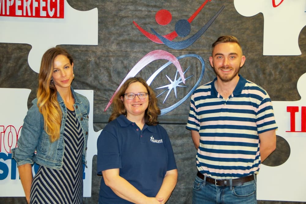 From left: Jessica Morales, Kristy Conrad and Collin Prusak help run The Village Centers. (Wesley Gardner/Community Impact)