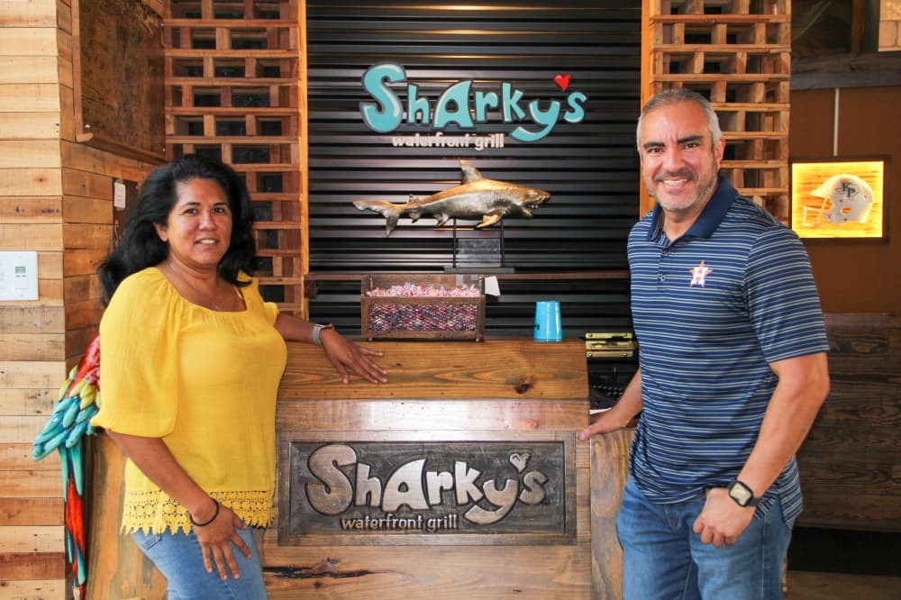 Owners Rosa and Ronald Perez purchased Sharky’s Waterfront Grill in Kingwood in 2018. (Wesley Gardner/Community Impact)
