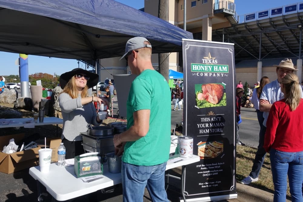 man getting food at booth 