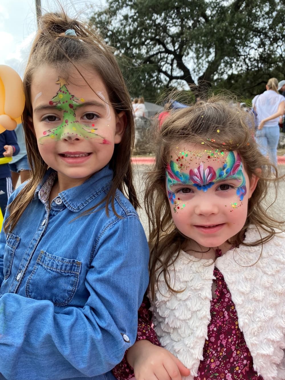 two kids with faces painted