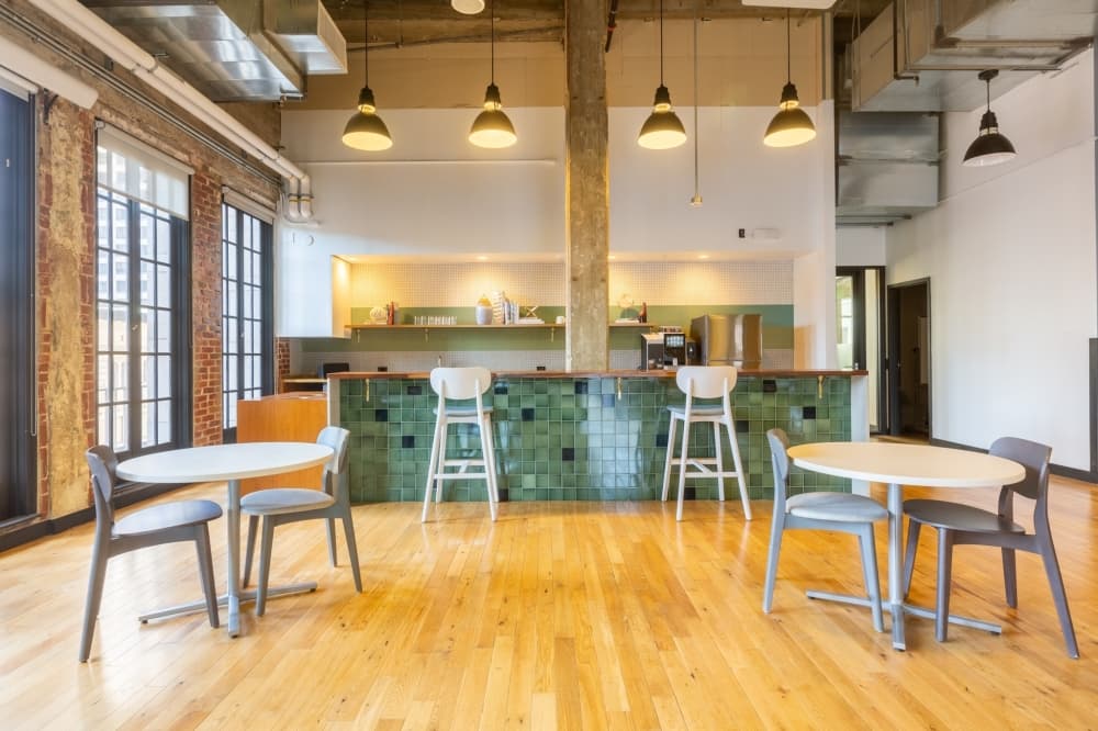 Tables and chairs and a counter at the back