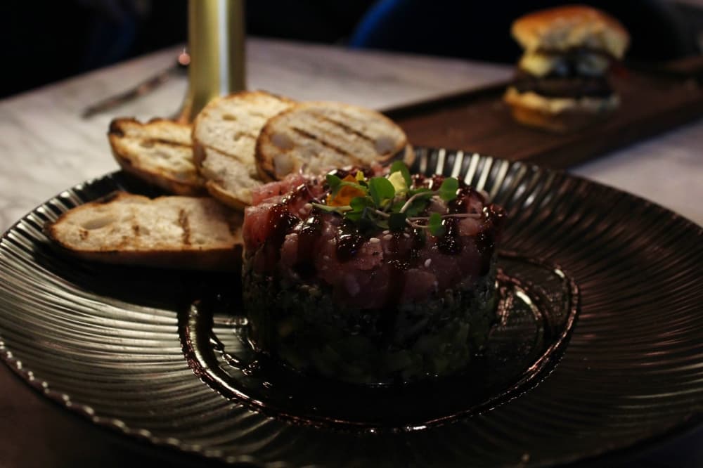 The ahi tuna tartare ($25) includes avocado, quinoa and nikkei sauce. (Shelbie Hamilton/Community Impact)