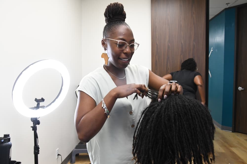 Natasia Collins and Loc'd N Studios help maintain loc hairstyles, and offers other services.