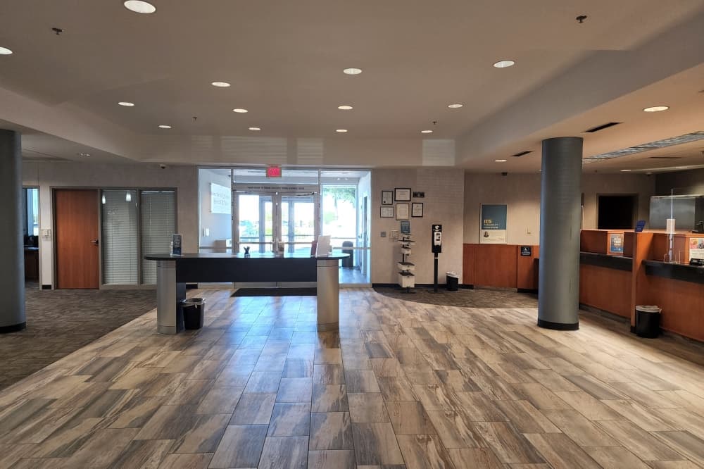 Inside a building with customer service counters of the right side.