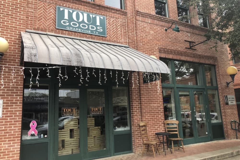 Exterior of store with green lined glass doors