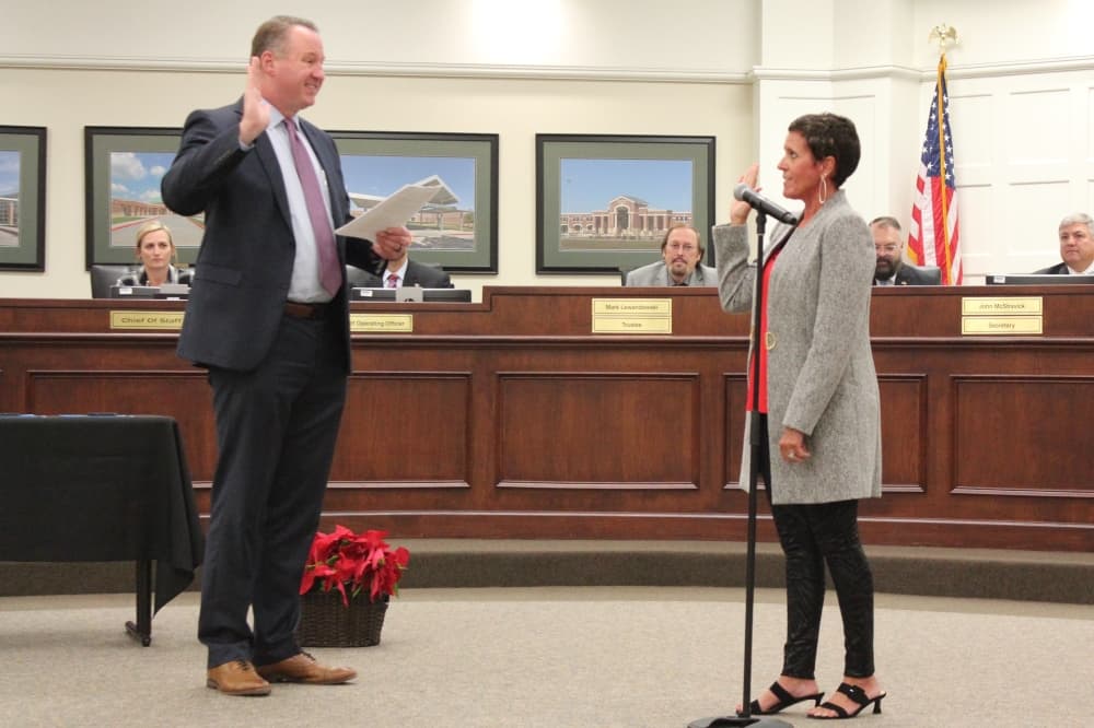 Tina Salem (right) is sworn in Dec. 6 to her first term on the board in Position 1. (Anna Lotz/Community Impact)
