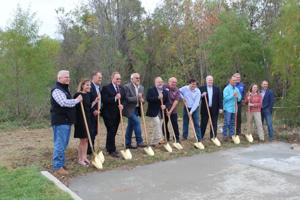 County and city leaders broke ground Dec. 6 for the David Memorial Drive extension, with construction set to begin in April. (Kylee Haueter/Community Impact)