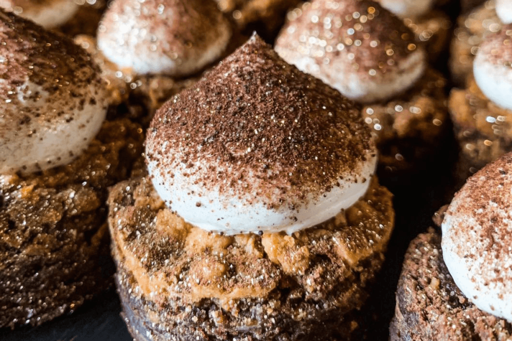 Alchemy Bake Lab concocts seasonal treats, like these buttercream brownies—made with butterscotch chip fudge brownie, swiss meringue buttercream, black cocoa dust and gold glitter flecks. (Courtesy Alchemy Bake Lab)