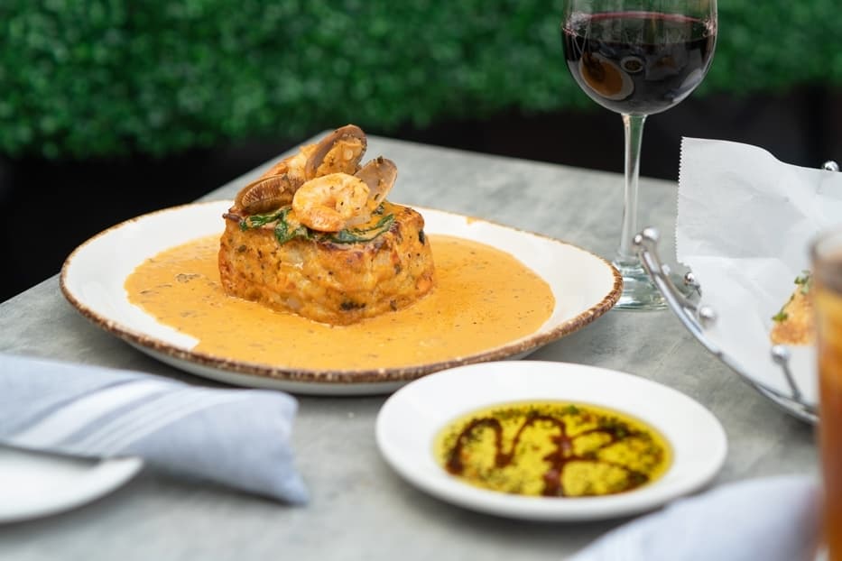 Seafood lasagna ($26): Layers of lasagna noodles, cheese and seafood are topped with lobster cream sauce, clams and jumbo shrimp. (Courtesy Mia Bella Trattoria)