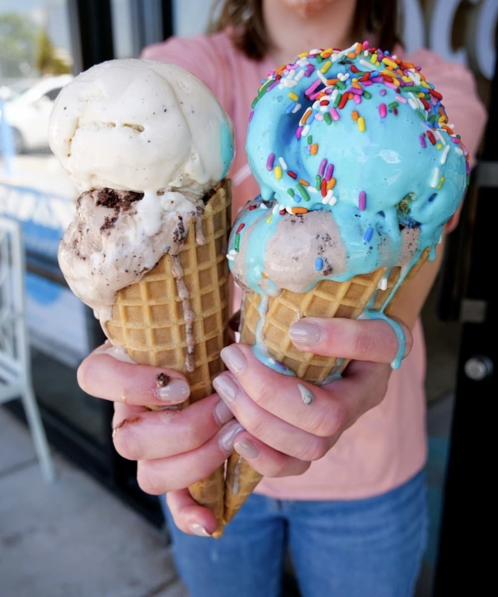 Two double-scoop waffle cones of house-made Cosmic Ice Cream. (Courtesy Cosmic Ice Cream)