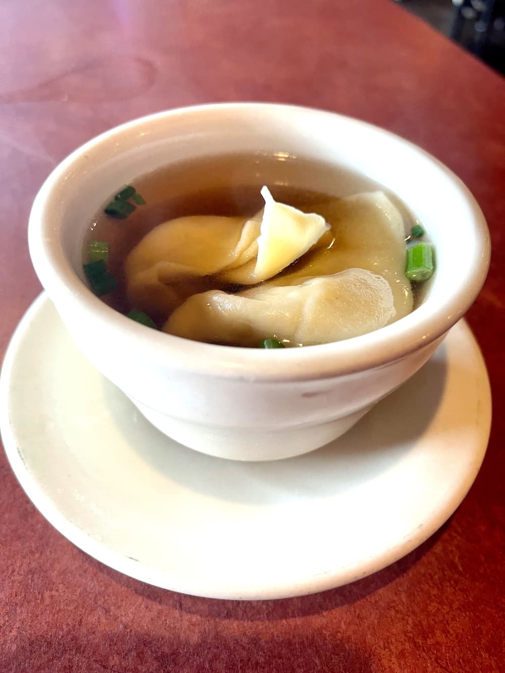 close-up shot of wonton soup in white bowl with saucer at shaghai express in georgetown