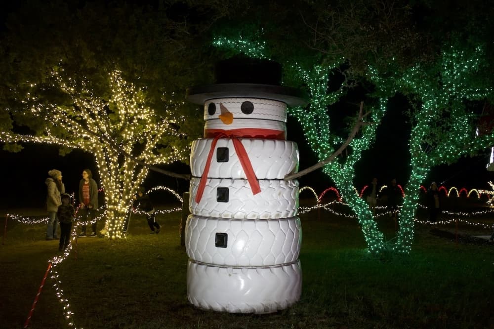 A large snowman is part of the Christmas display. (Elle Bent/Community Impact)