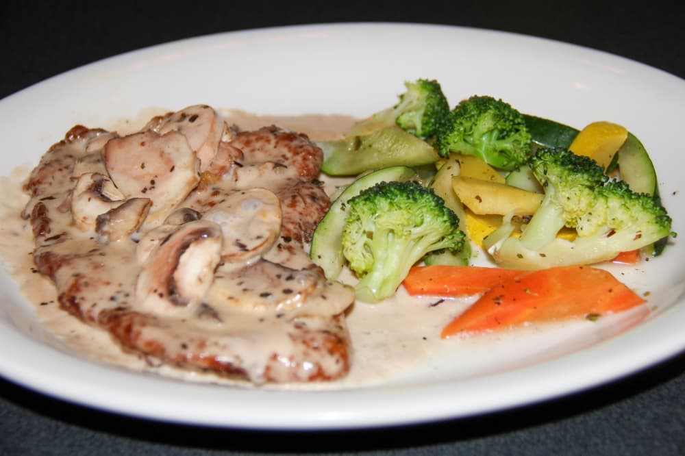 The Marsala ($14.95): Breaded chicken or veal is topped with a marsala wine sauce and mushrooms and served with angel hair marinara. (Wesley Gardner/Community Impact)