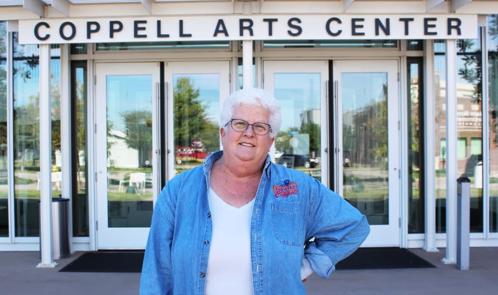 Director posing in front of the arts center 