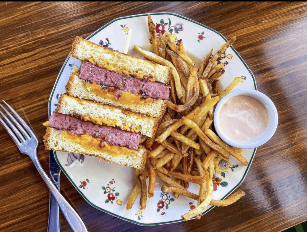 decorative plate with spam sandwich, french fries and dipping sauce