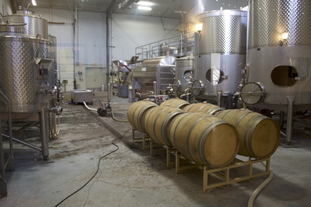 barrels of wine and canisters of wine at fall creek vineyards