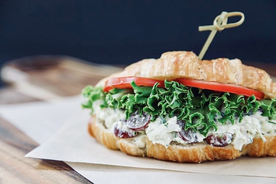The chicken salad sandwich at Radish and Dill Fine Food Market features Red Bird Farm chicken, cornichons, celery, onion and grapes. (Courtesy Radish and Dill Fine Food Market)