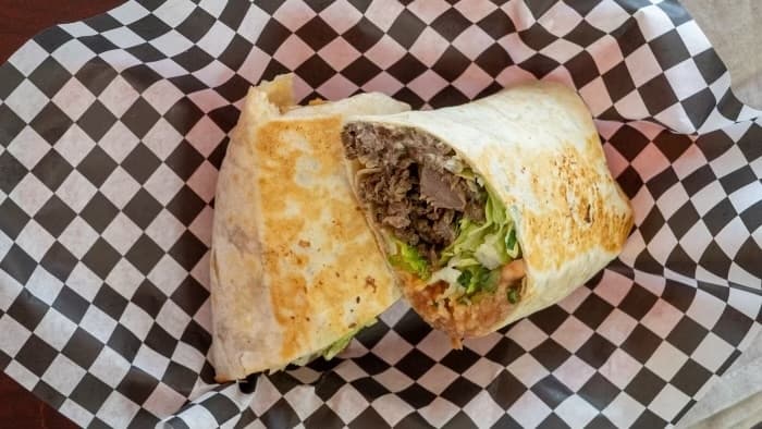 Burritos are served with a choice of meat, rice, beans, lettuce and pico de gallo. (Courtesy Tacos El Gordo)