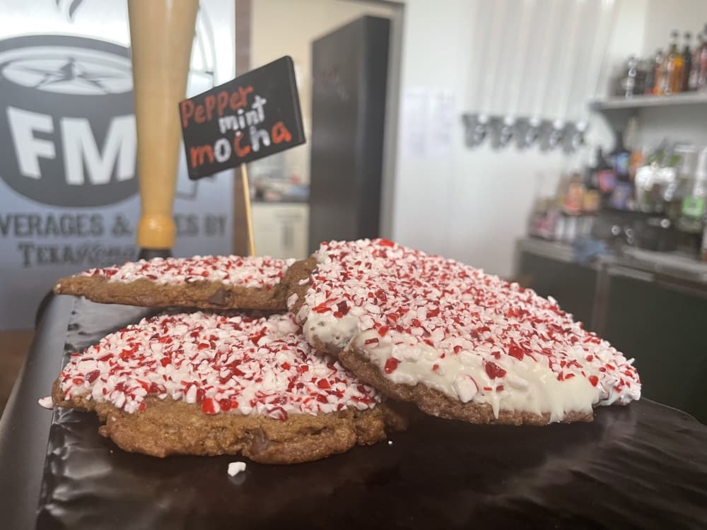 cookies with white frosting and sprinkles