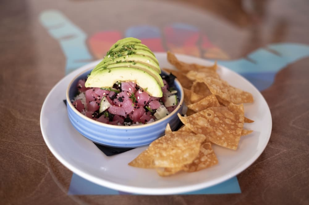 Fresh Tuna Poke Bowl ($19) is yellow fin tuna with ginger yuzu sauce, cucumber, seaweed, sesame seeds, avocado, tobiko caviar and sticky rice. 