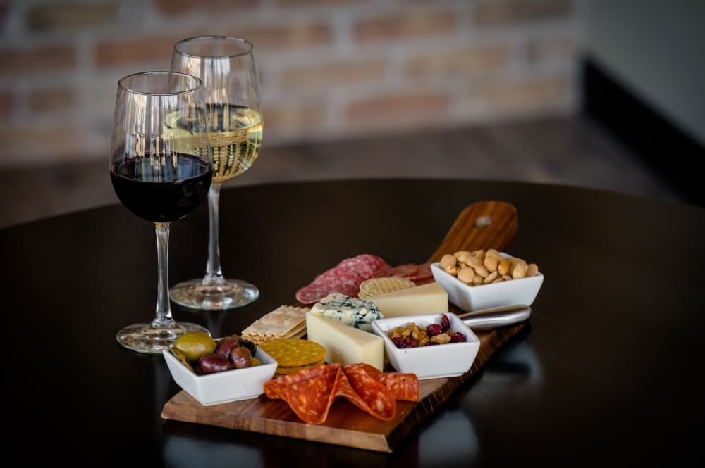 Charcuterie board ($25): This customizable option includes the patron's choice of two gourmet meats and three cheeses served with crackers, nuts, veggies and dried fruits. (Courtesy The Classy Cork/Tiffany Hofeldt Photography)