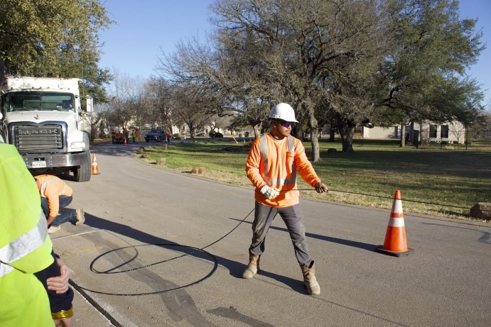 Google Fiber officials install fiber directly into the ground, using shallow trenching. (Elle Bent/Community Impact)